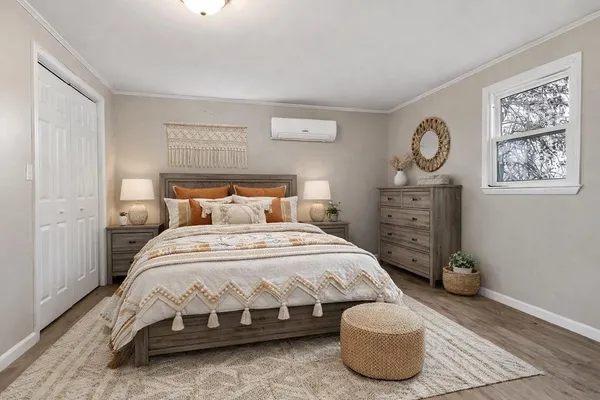 a bedroom with a bed and a lamp