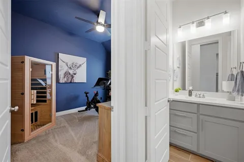 a view of room with walk in closet and bathroom