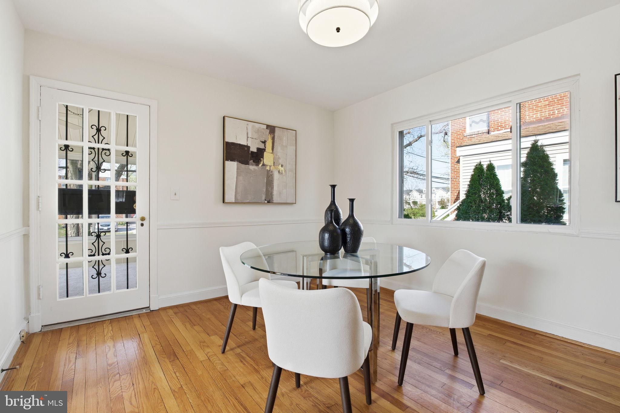 11527 Grandview Avenue Silver Spring, MD 20902 - Photo 12 of 36 a dining room with furniture and wooden floor