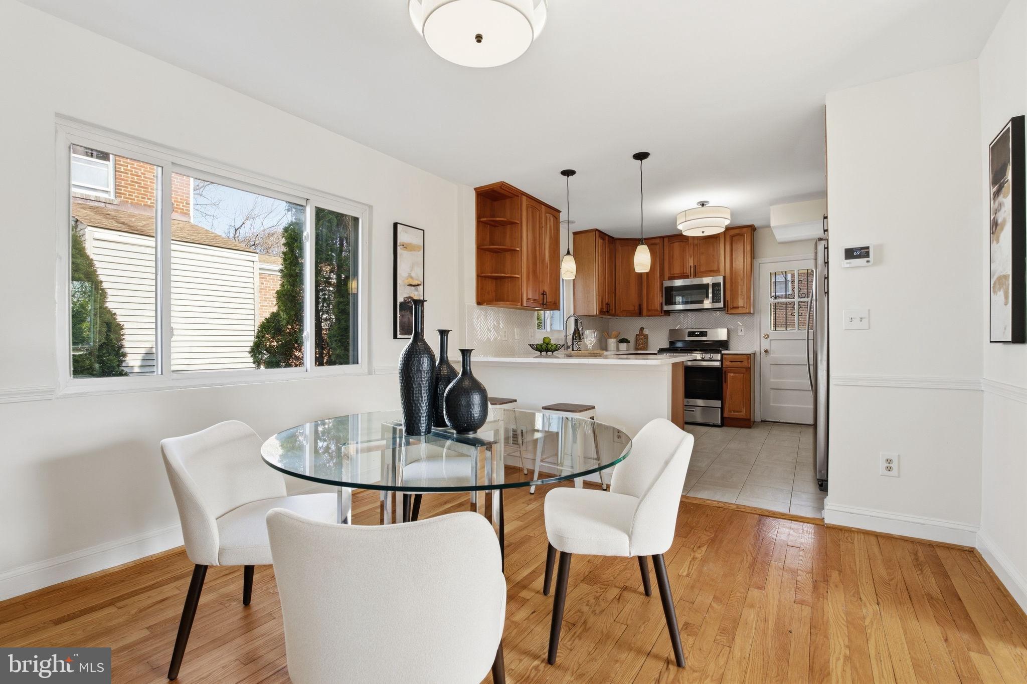 11527 Grandview Avenue Silver Spring, MD 20902 - Photo 13 of 36 a dining room with furniture and wooden floor