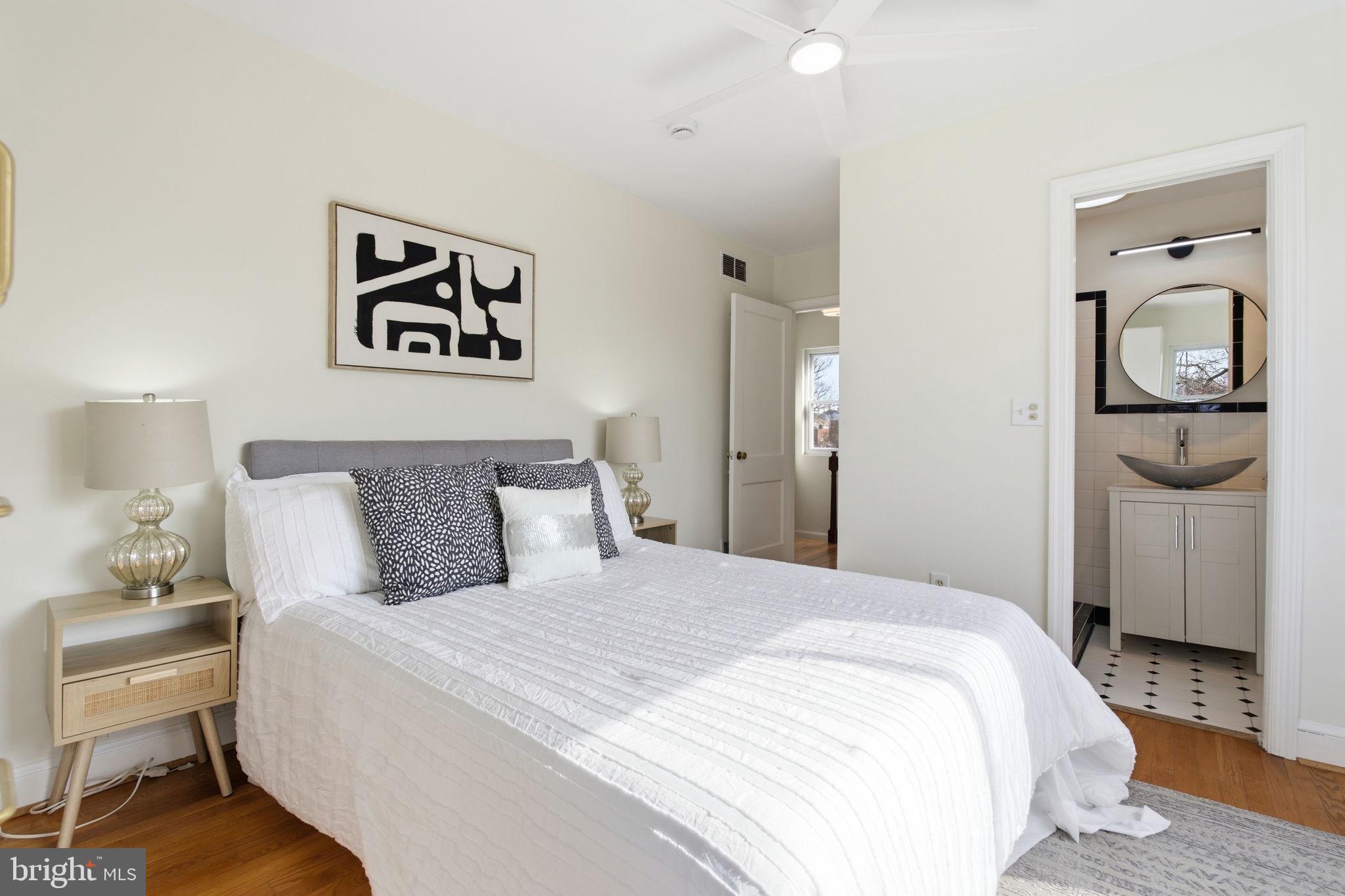 11527 Grandview Avenue Silver Spring, MD 20902 - Photo 15 of 36 a bedroom with a bed and a lamp