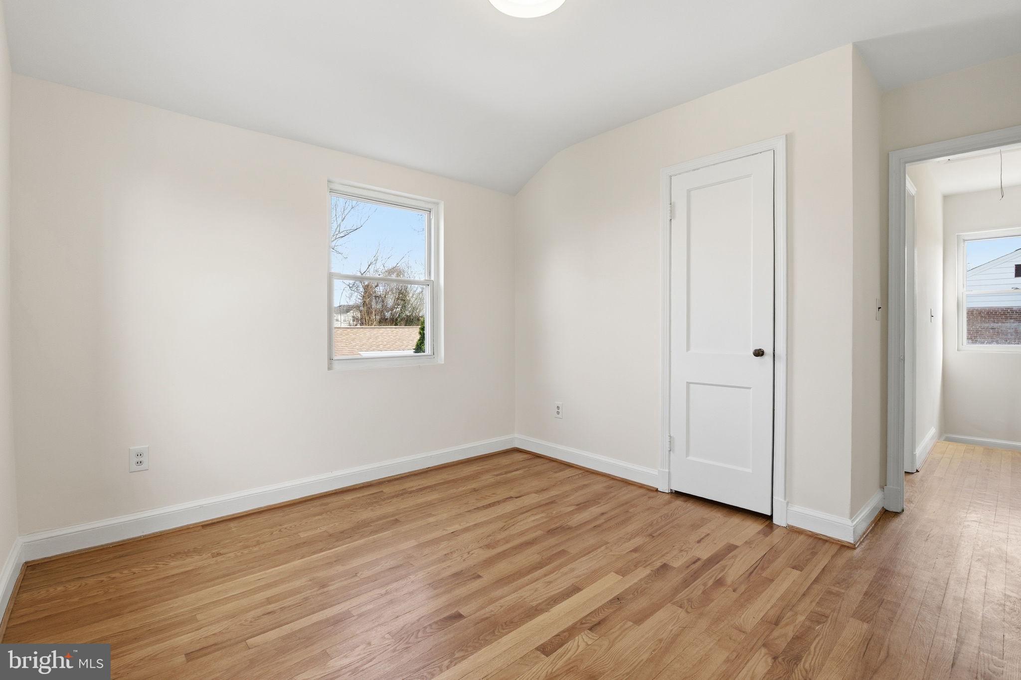 11527 Grandview Avenue Silver Spring, MD 20902 - Photo 19 of 36 an empty room with wooden floor and windows
