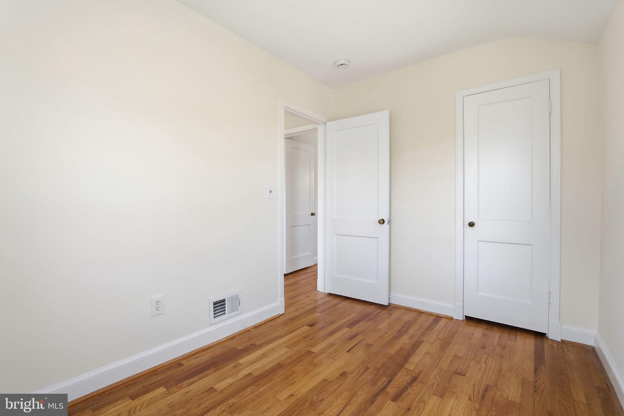 11527 Grandview Avenue Silver Spring, MD 20902 - Photo 21 of 36 a view of an empty room with wooden floor