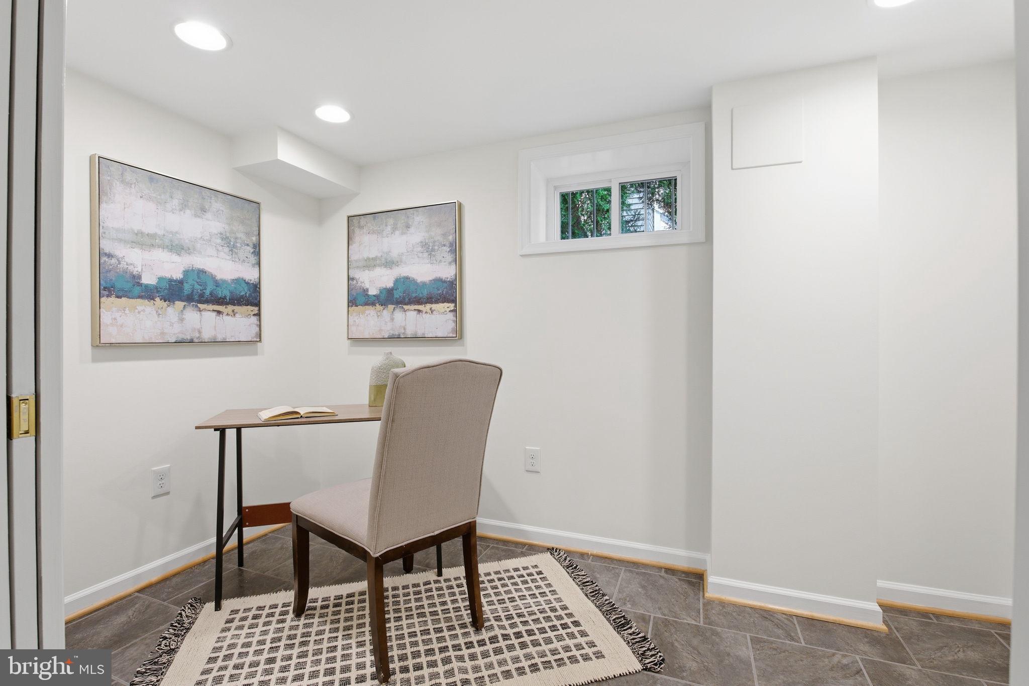 11527 Grandview Avenue Silver Spring, MD 20902 - Photo 29 of 36 a view of a livingroom with furniture and a workspace