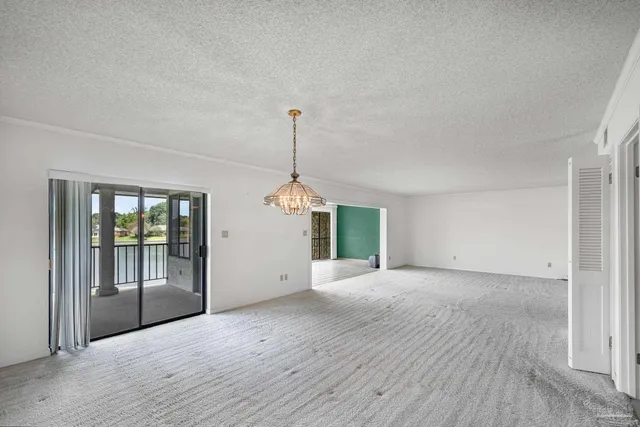 an aerial view of a house with a garden and swimming pool