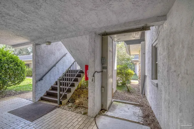 a view of a hallway with a window