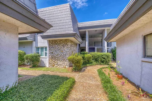 a view of a lake with a house in the background