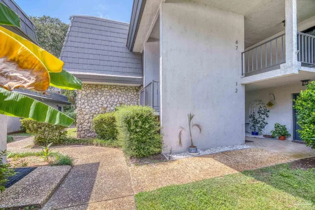 a view of a lake with a house in the background