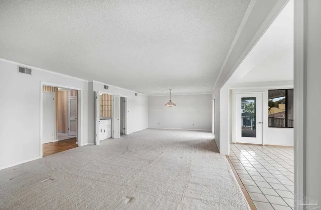 a kitchen with stainless steel appliances a stove a sink and a cabinets