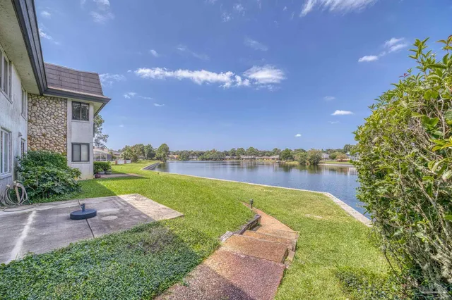 a bathroom with a sink and a refrigerator