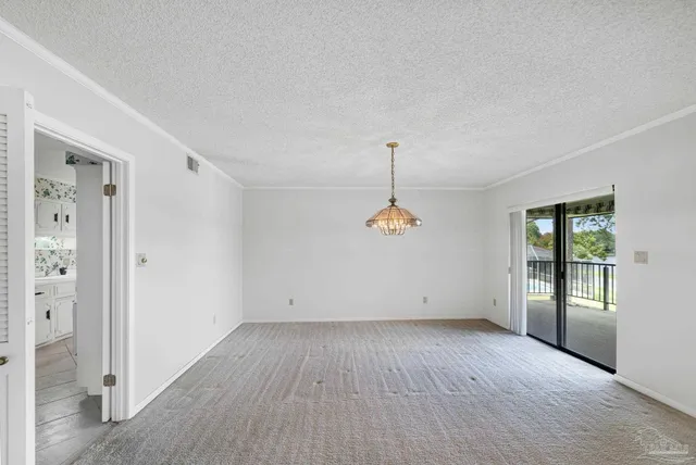 wooden floor in an empty room with a ceiling fan