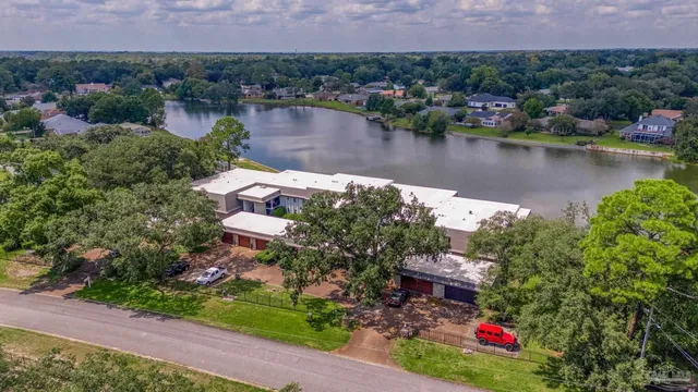 an aerial view of a house with a lake view