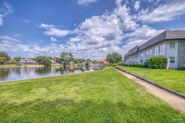 a view of a lake with a house in the background