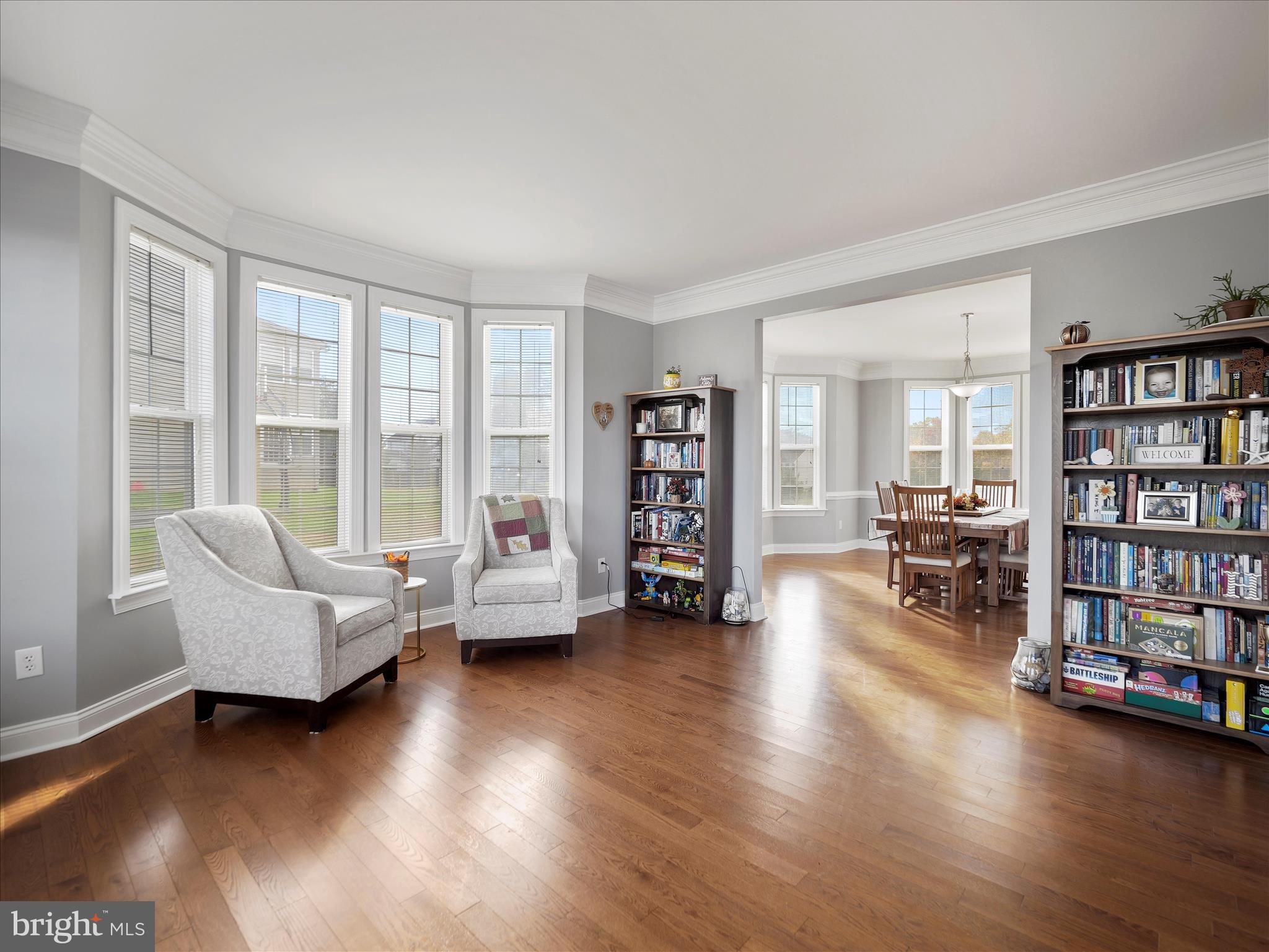 837 Triumphant Way Falling Waters, WV 25419 - Photo 23 of 66 a living room with furniture and a book shelf