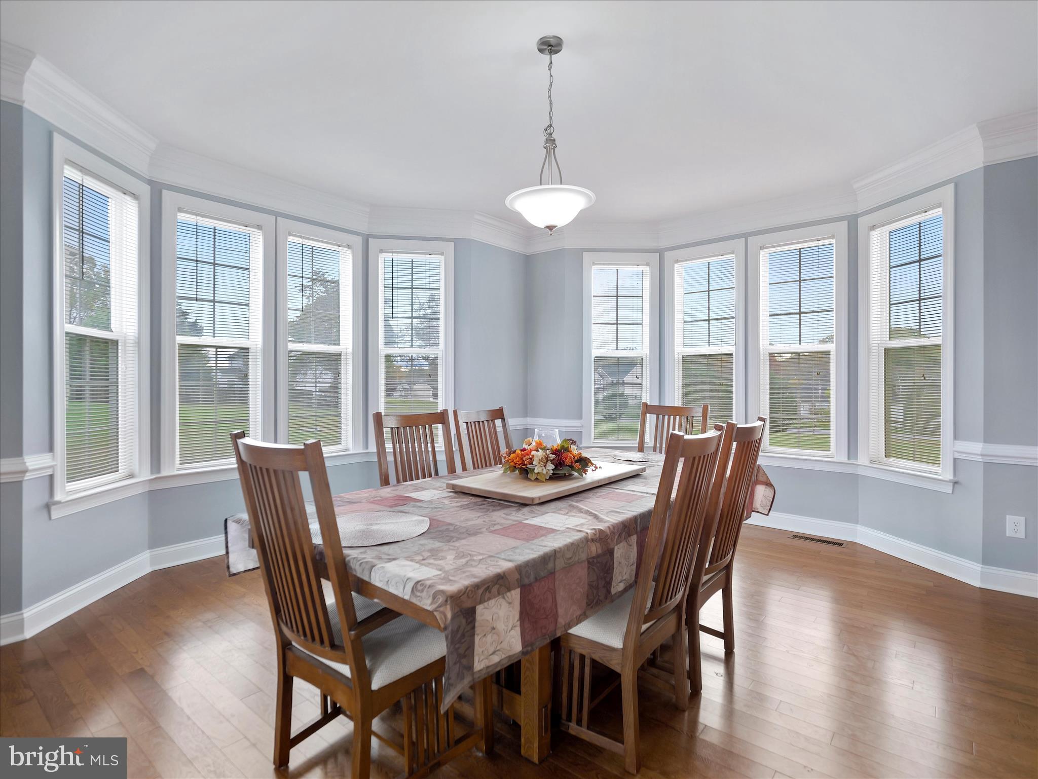 837 Triumphant Way Falling Waters, WV 25419 - Photo 24 of 66 a view of a dining room with furniture window and wooden floor