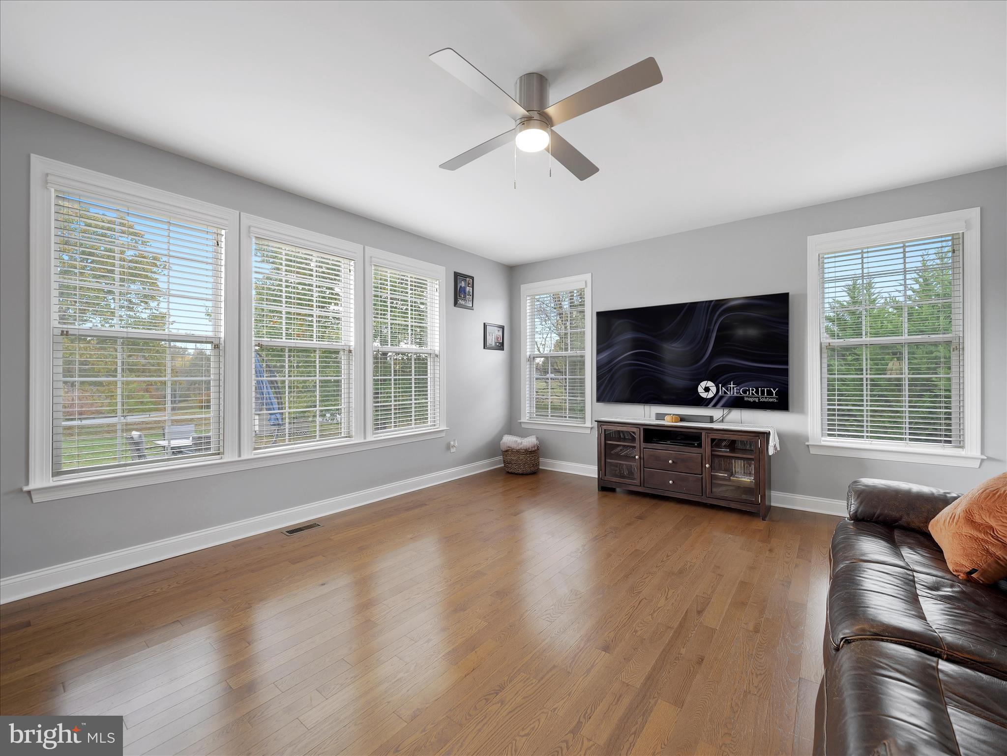 837 Triumphant Way Falling Waters, WV 25419 - Photo 32 of 66 a view of livingroom with furniture window and wooden floor