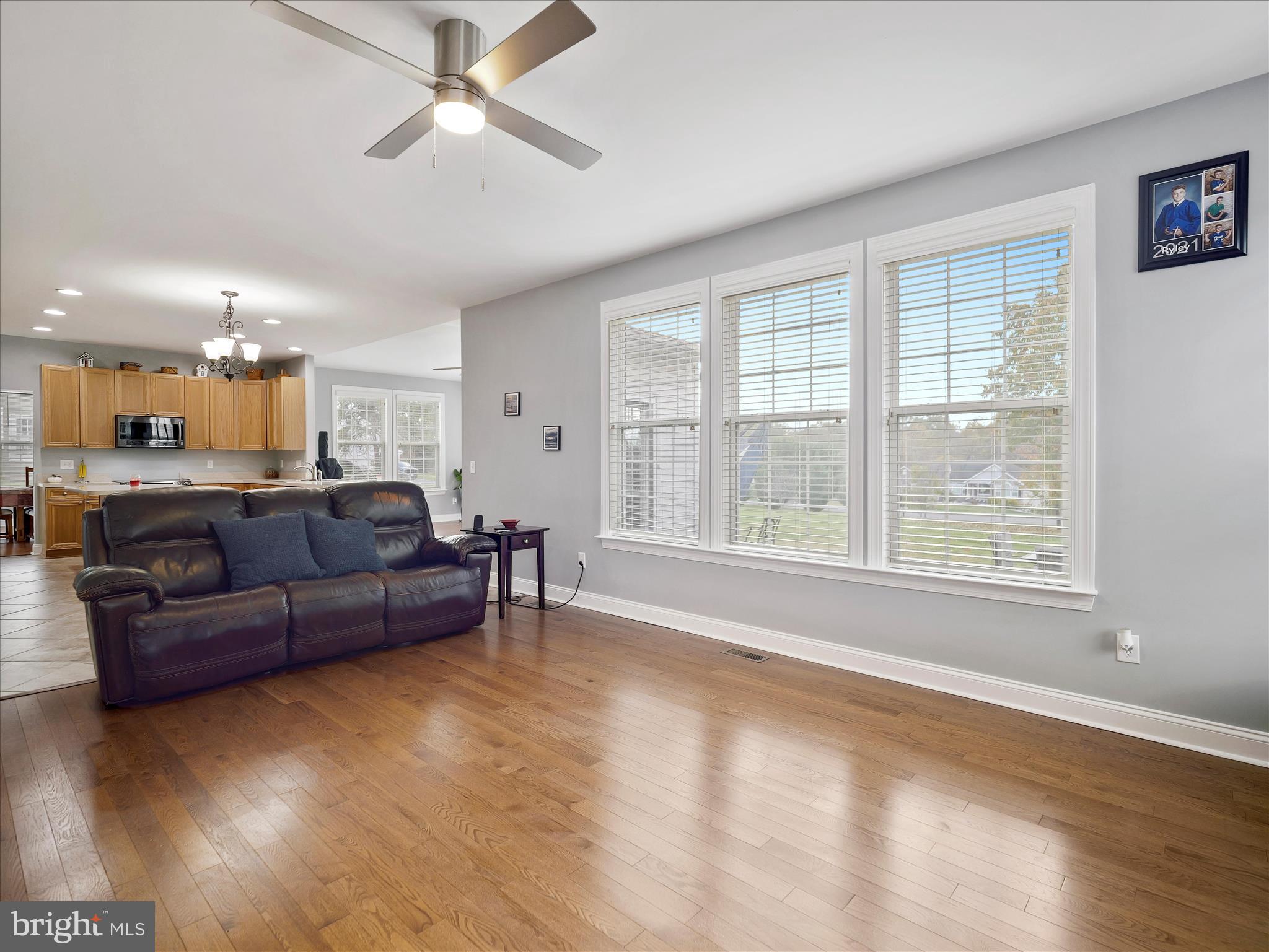 837 Triumphant Way Falling Waters, WV 25419 - Photo 34 of 66 a living room with furniture and a large window