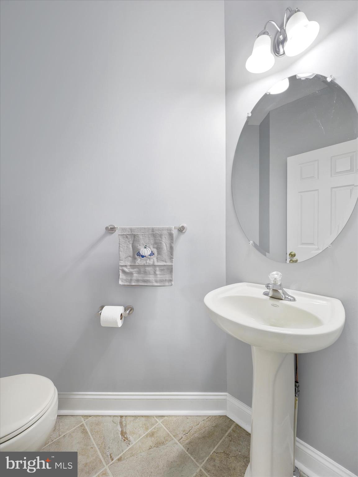 837 Triumphant Way Falling Waters, WV 25419 - Photo 37 of 66 a bathroom with a sink a toilet and mirror