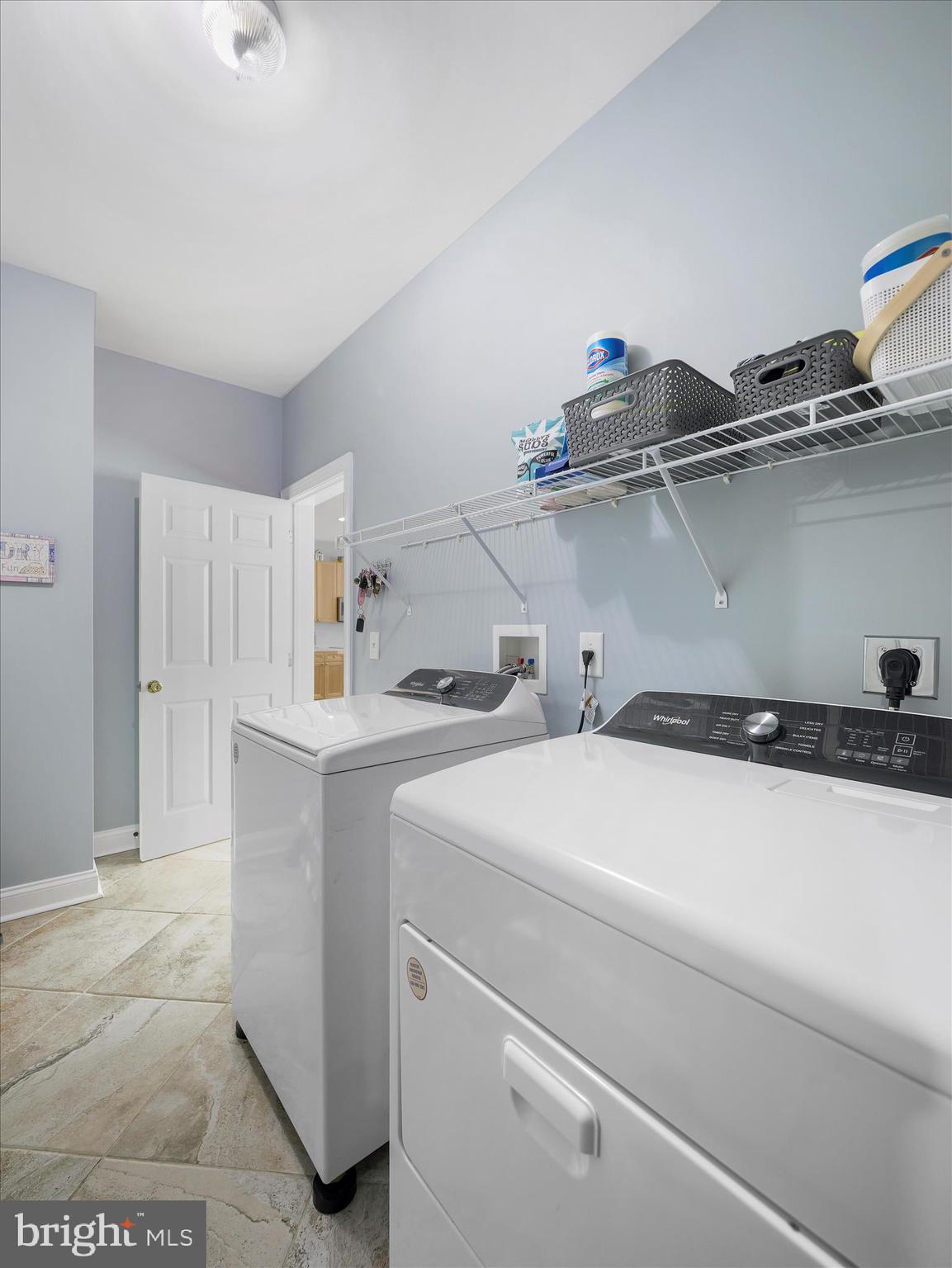 837 Triumphant Way Falling Waters, WV 25419 - Photo 38 of 66 a utility room with dryer and washer