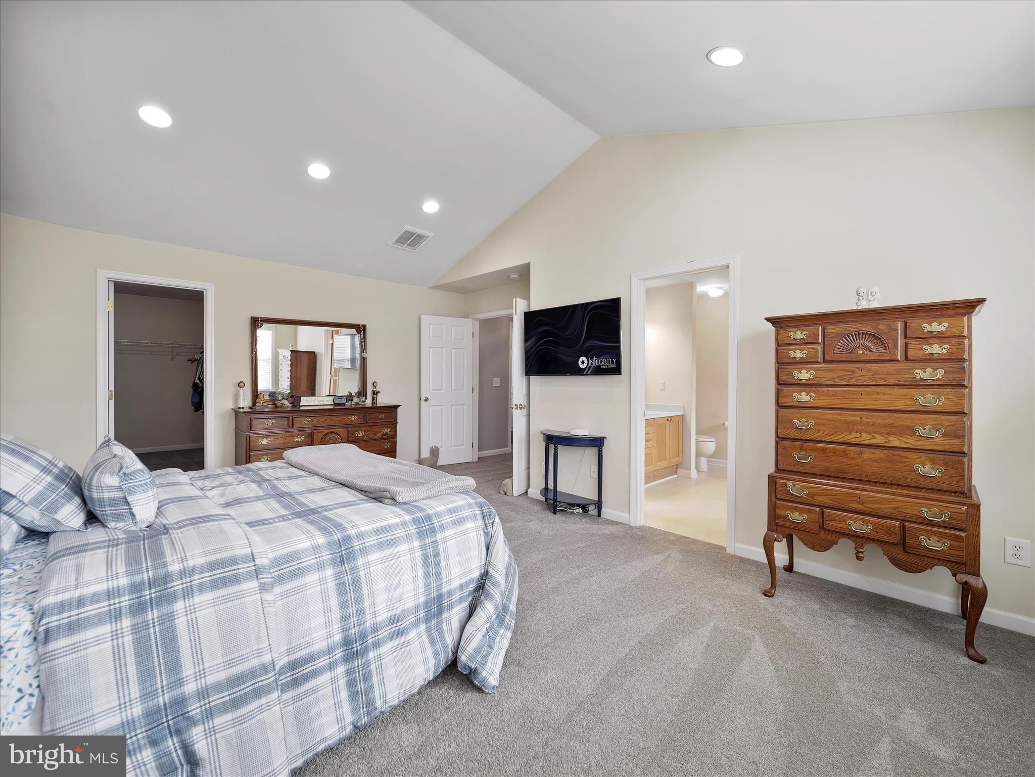 837 Triumphant Way Falling Waters, WV 25419 - Photo 42 of 66 a spacious bedroom with a bed and a television