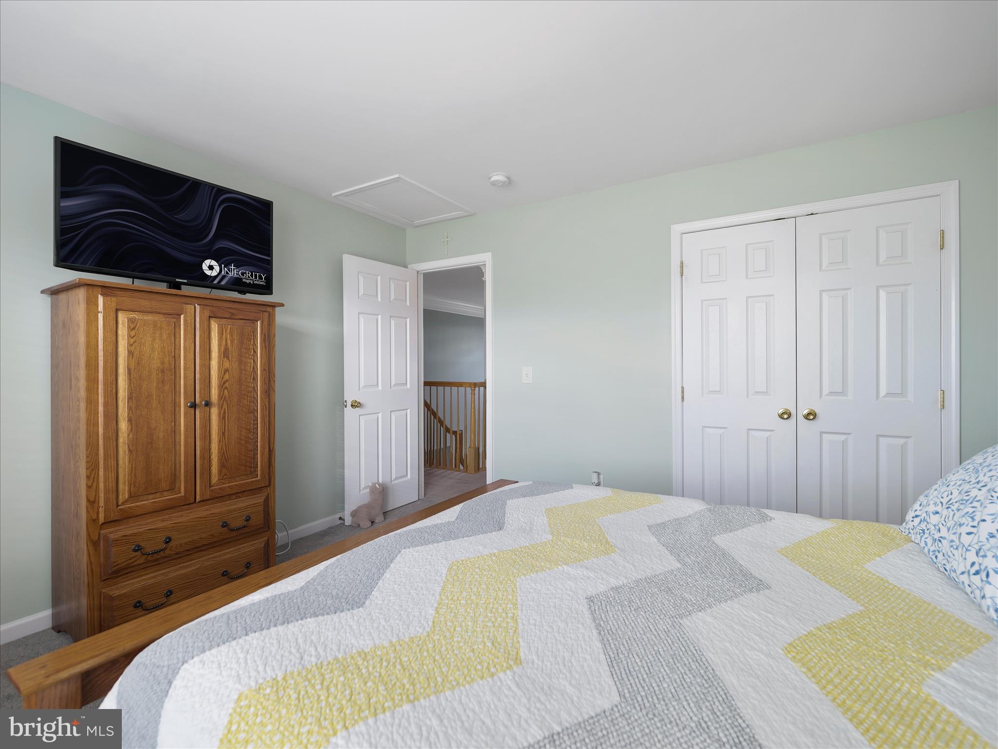 837 Triumphant Way Falling Waters, WV 25419 - Photo 49 of 66 a bedroom with a bed and a walk in closet