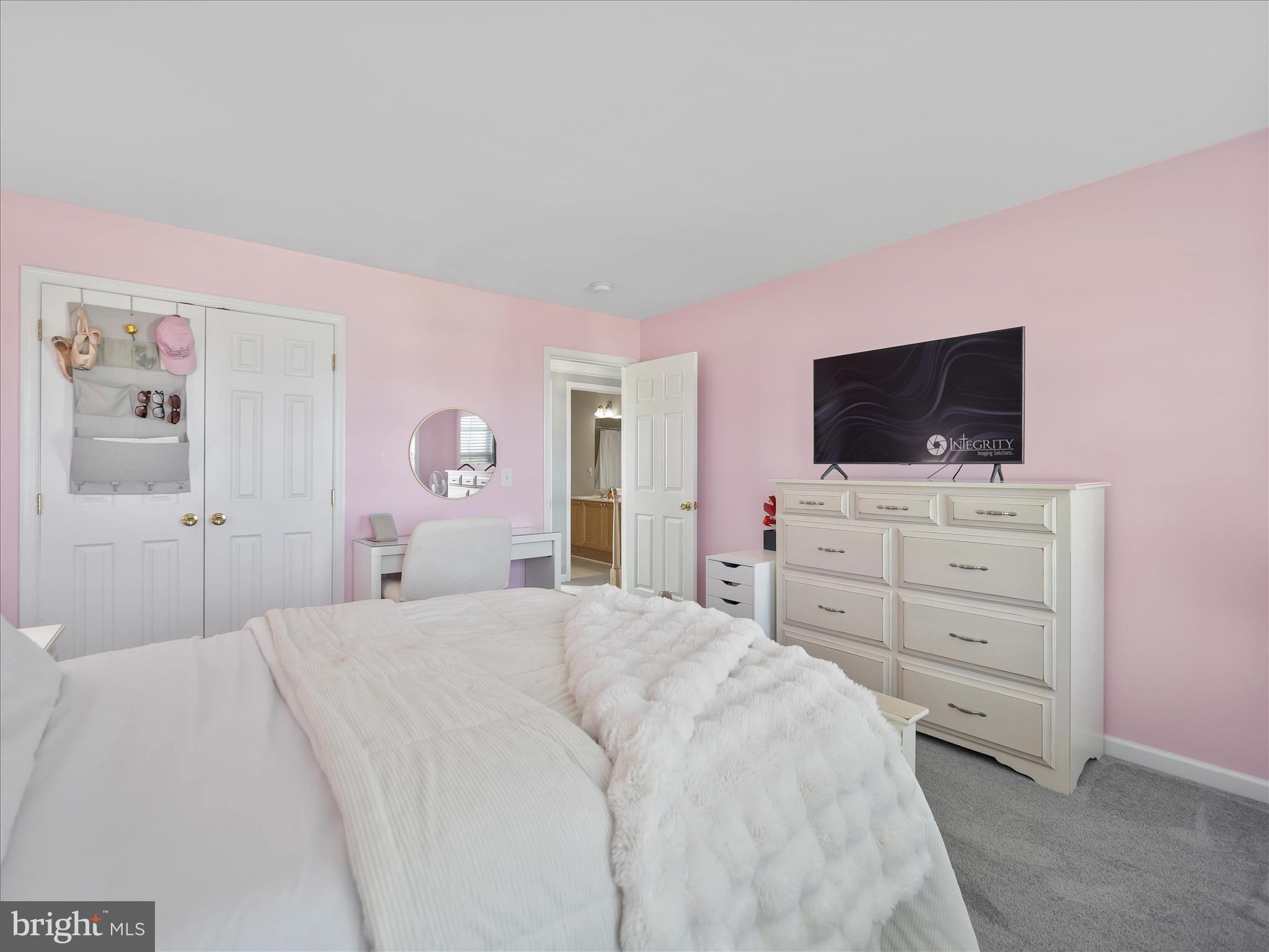 837 Triumphant Way Falling Waters, WV 25419 - Photo 52 of 66 a bedroom with a bed and a flat screen tv