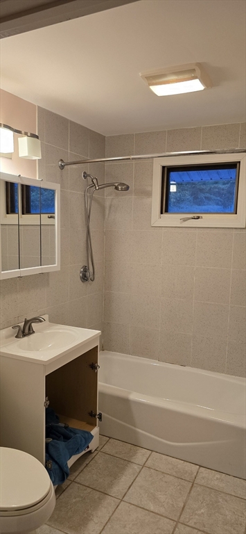 403 South Main Street, Unit 1 Sharon, MA 02067 - Photo 11 of 16 a bathroom with a sink a toilet and shower