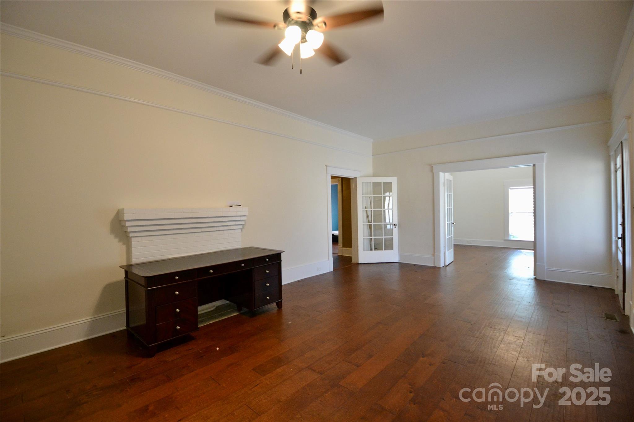 512 2nd Street Spencer, NC 28159 - Photo 11 of 33 a view of empty room with wooden floor and fan