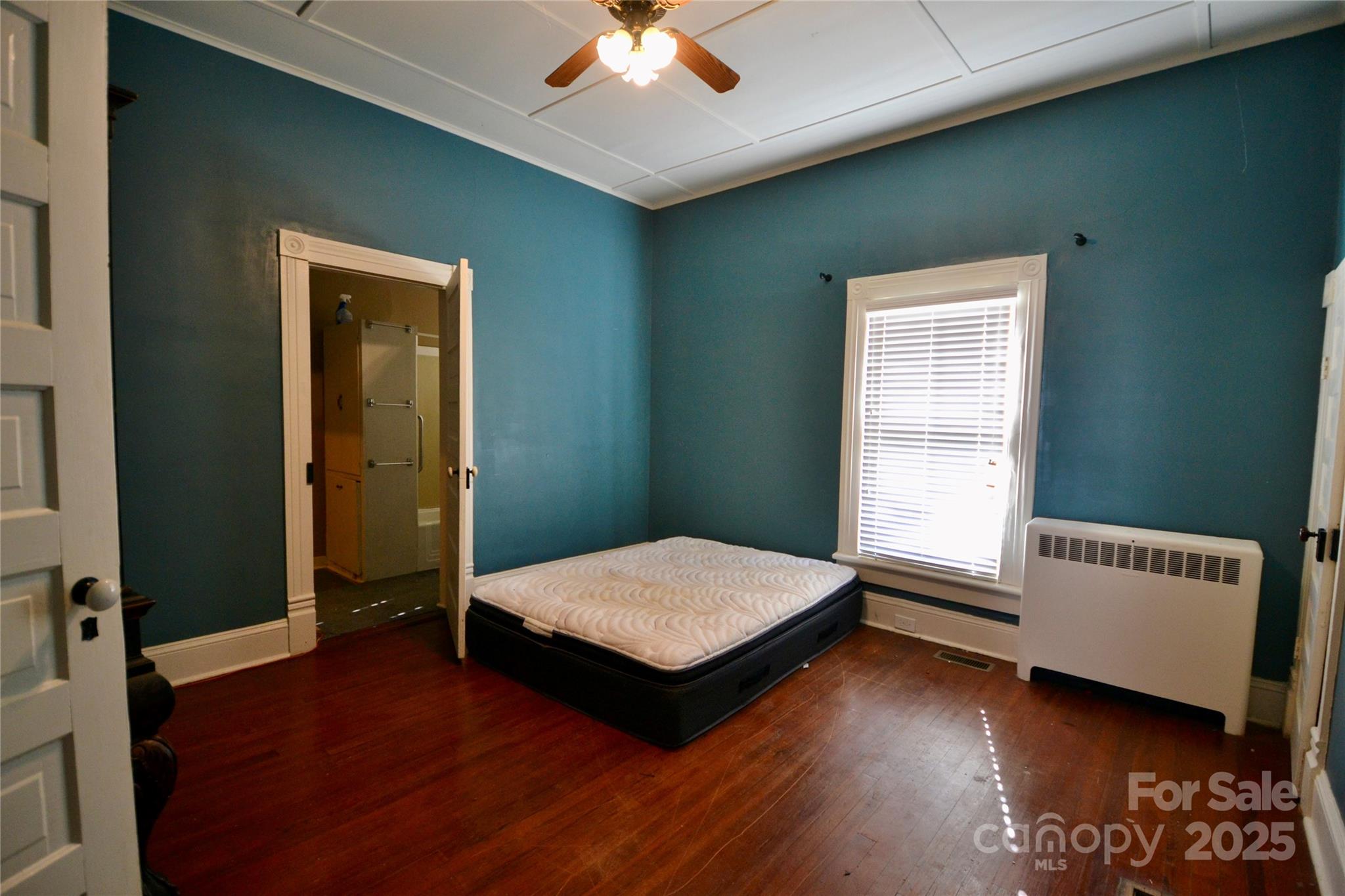 512 2nd Street Spencer, NC 28159 - Photo 22 of 33 a living room with a bed furniture and a window