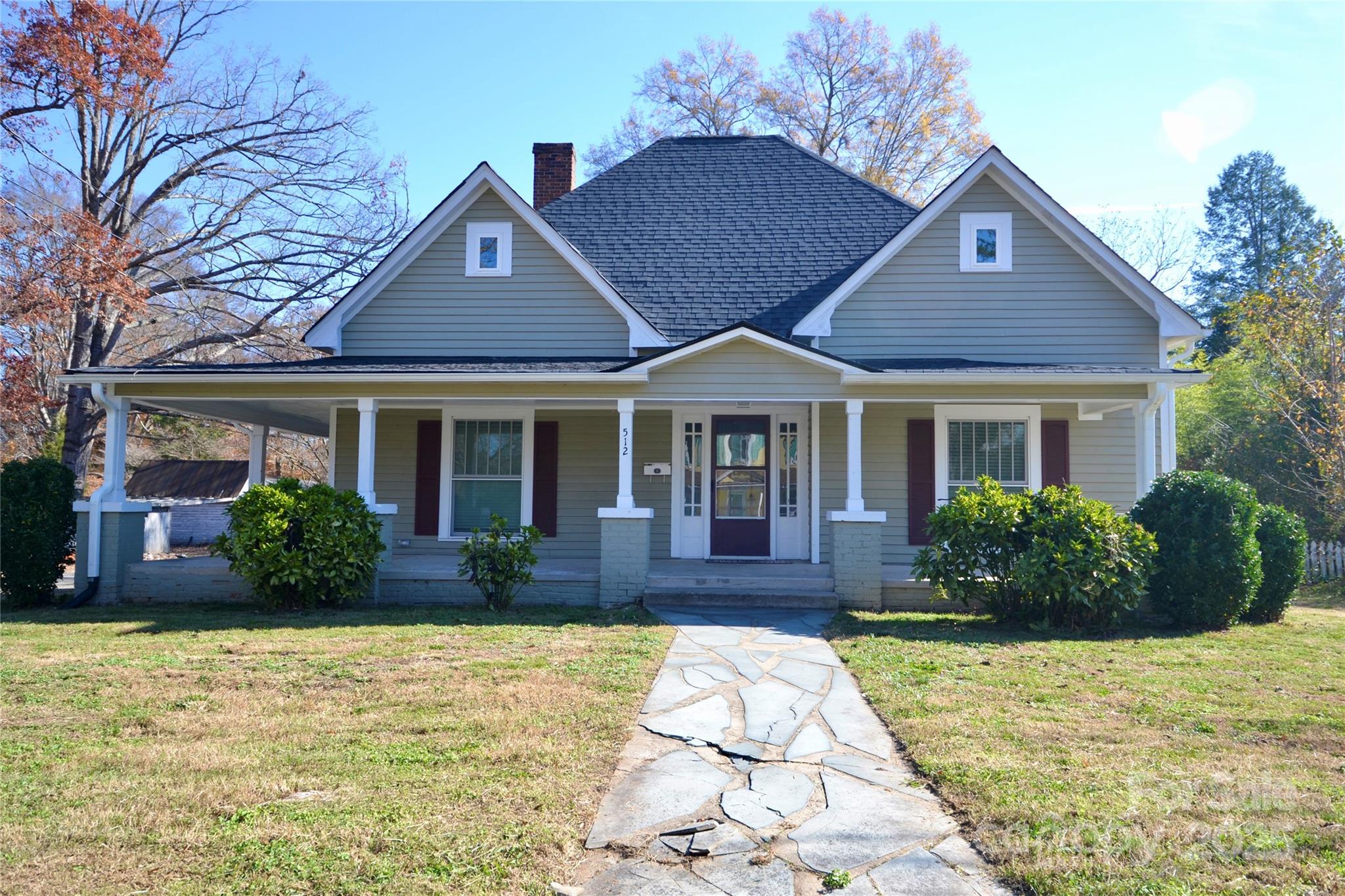 512 2nd Street Spencer, NC 28159 - Photo 33 of 33 a front view of a house with a yard and potted plants