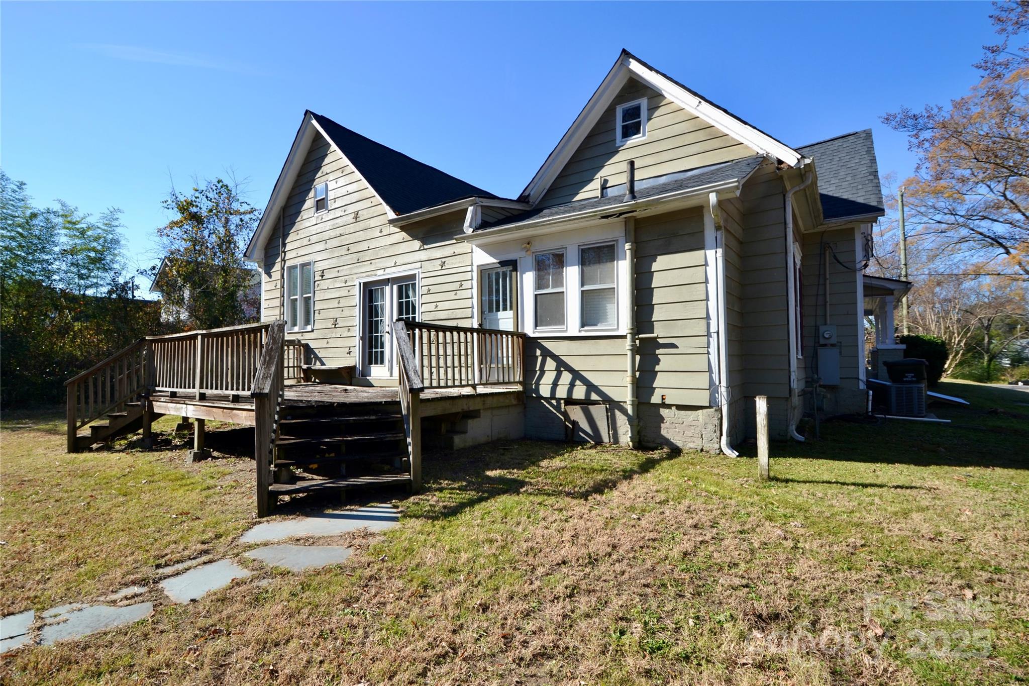 512 2nd Street Spencer, NC 28159 - Photo 7 of 33 a view of a house with a yard chairs and floor to ceiling window