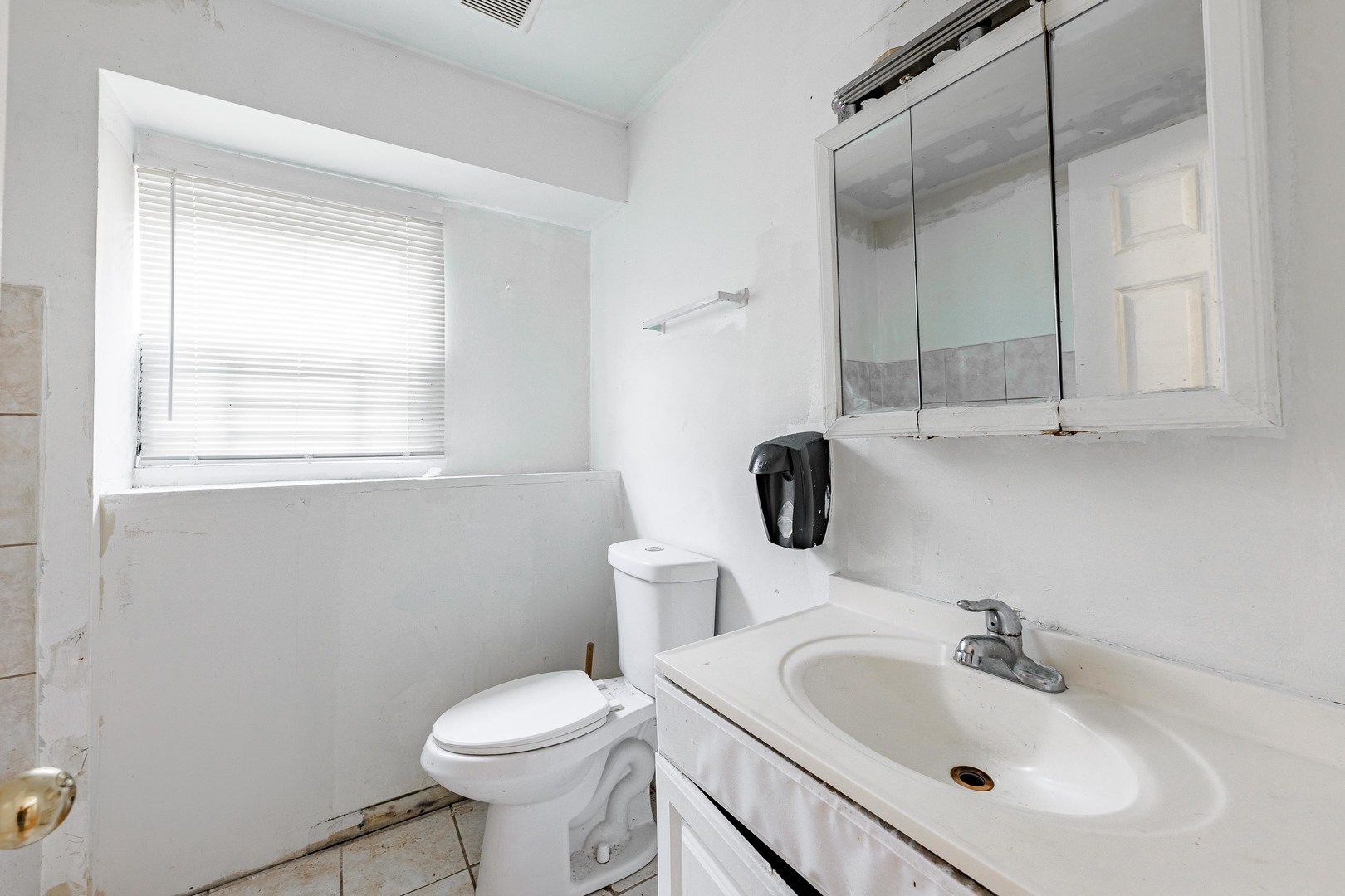 98 West 154th Street Harvey, IL 60426 - Photo 7 of 8 a bathroom with a sink toilet and a mirror