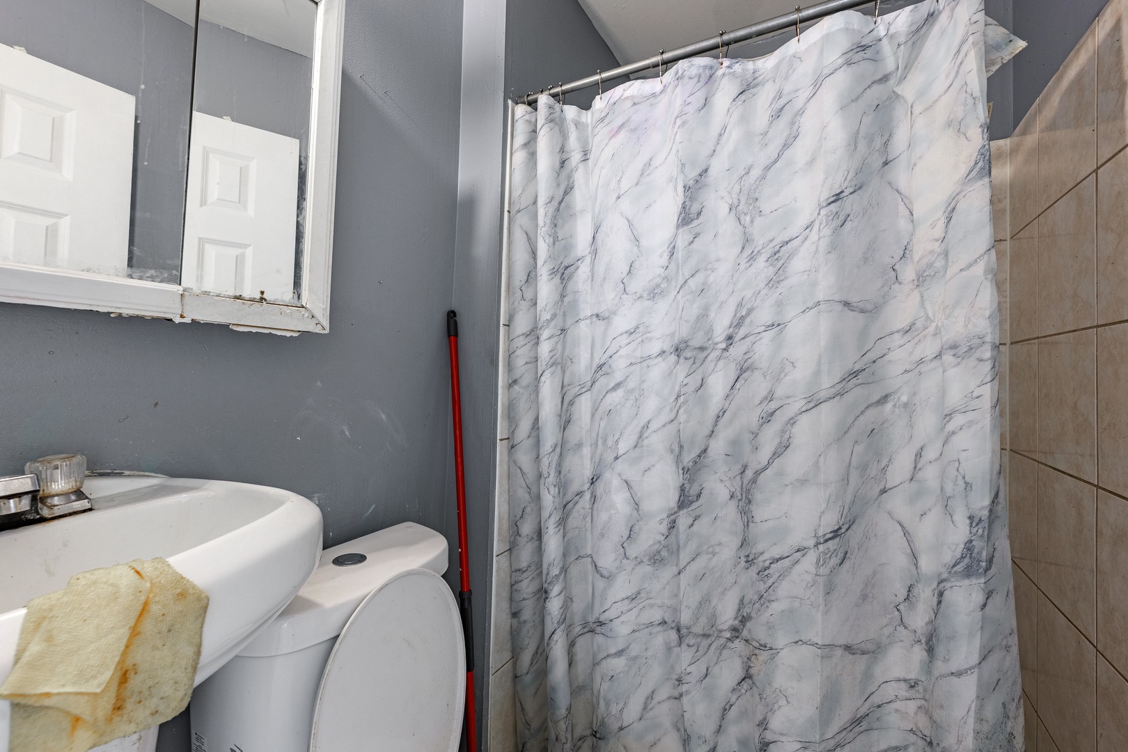 98 West 154th Street Harvey, IL 60426 - Photo 8 of 8 a bathroom with a sink and toilet