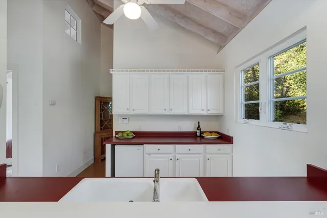 a kitchen with a sink and a stove top oven