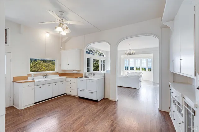 a view of cabinets and wooden floor