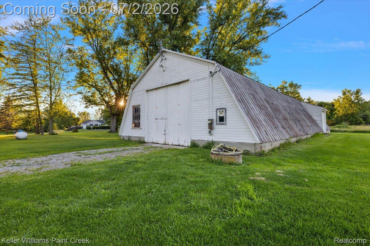 54230 Card Road Macomb, MI 48042 - Photo 10 of 73 Large white barn structure with a gambrel roof design