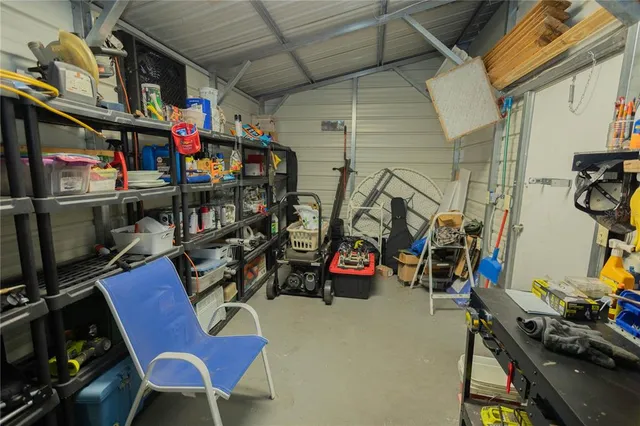 a view of house with backyard and trees