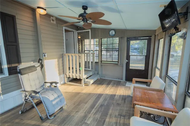 a room with gym equipment and large window