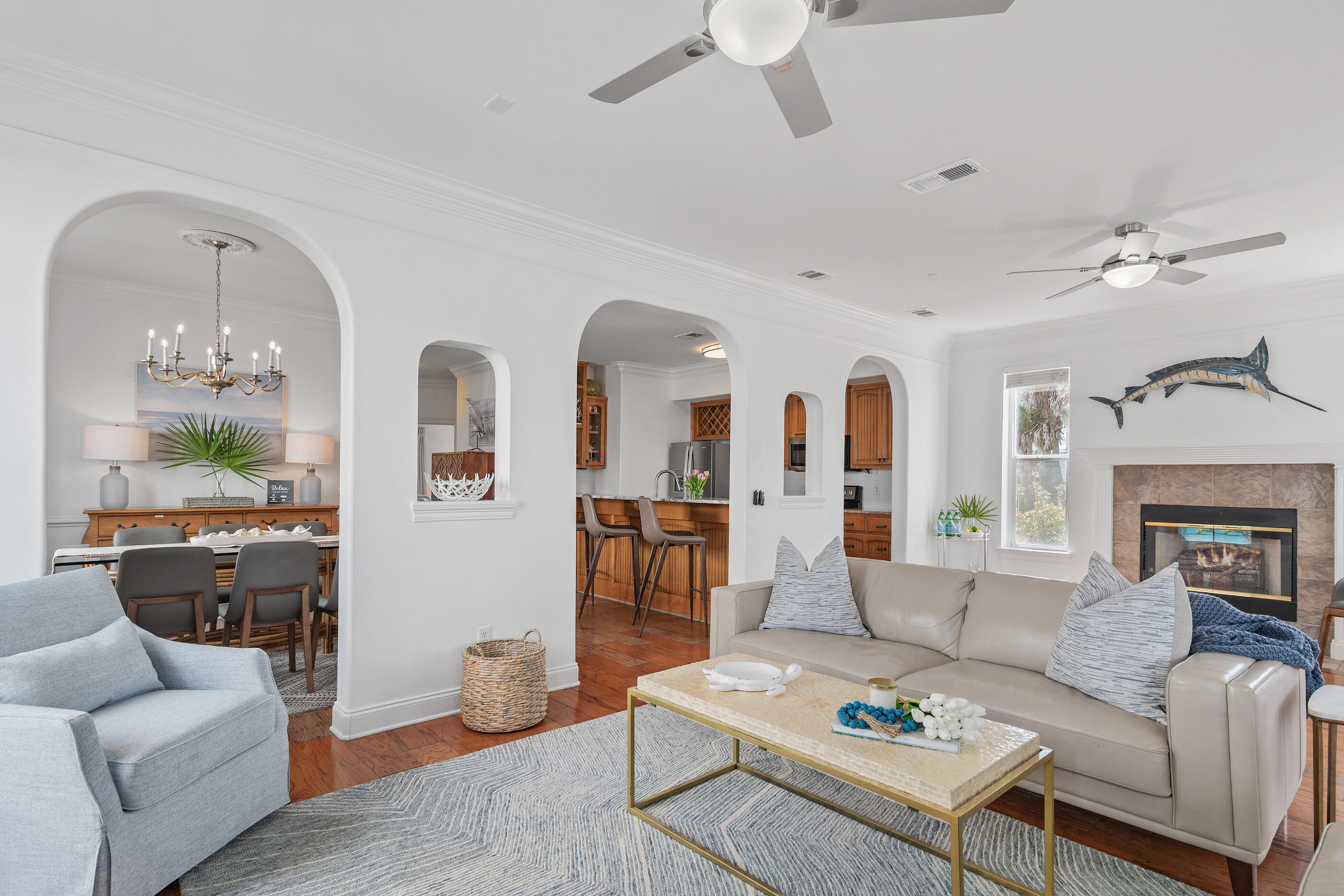 34 Beachside Drive Santa Rosa Beach, FL 32459 - Photo 17 of 65 a living room with furniture fireplace and a chandelier