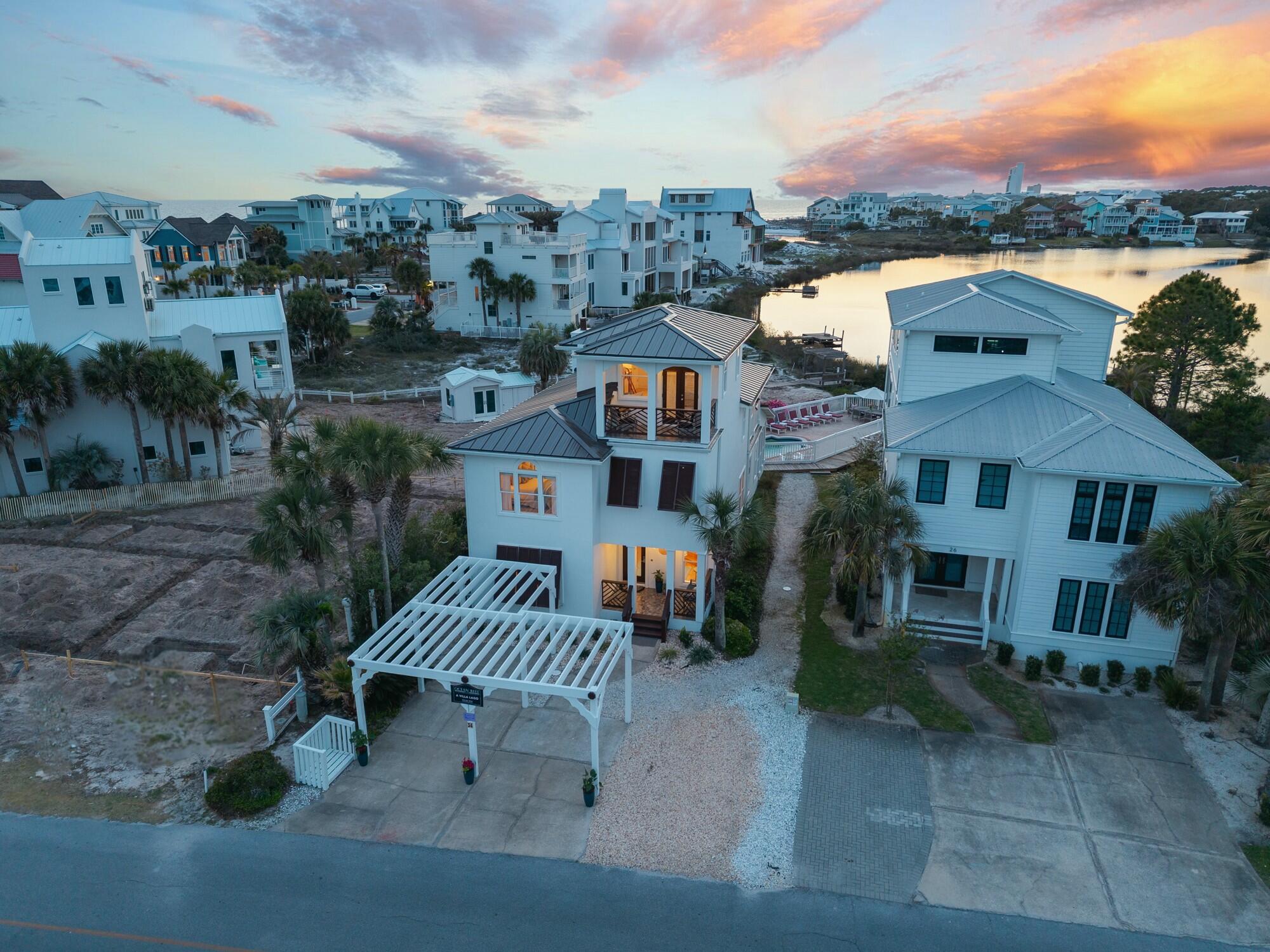 34 Beachside Drive Santa Rosa Beach, FL 32459 - Photo 2 of 65 an aerial view of a house with a yard and balcony