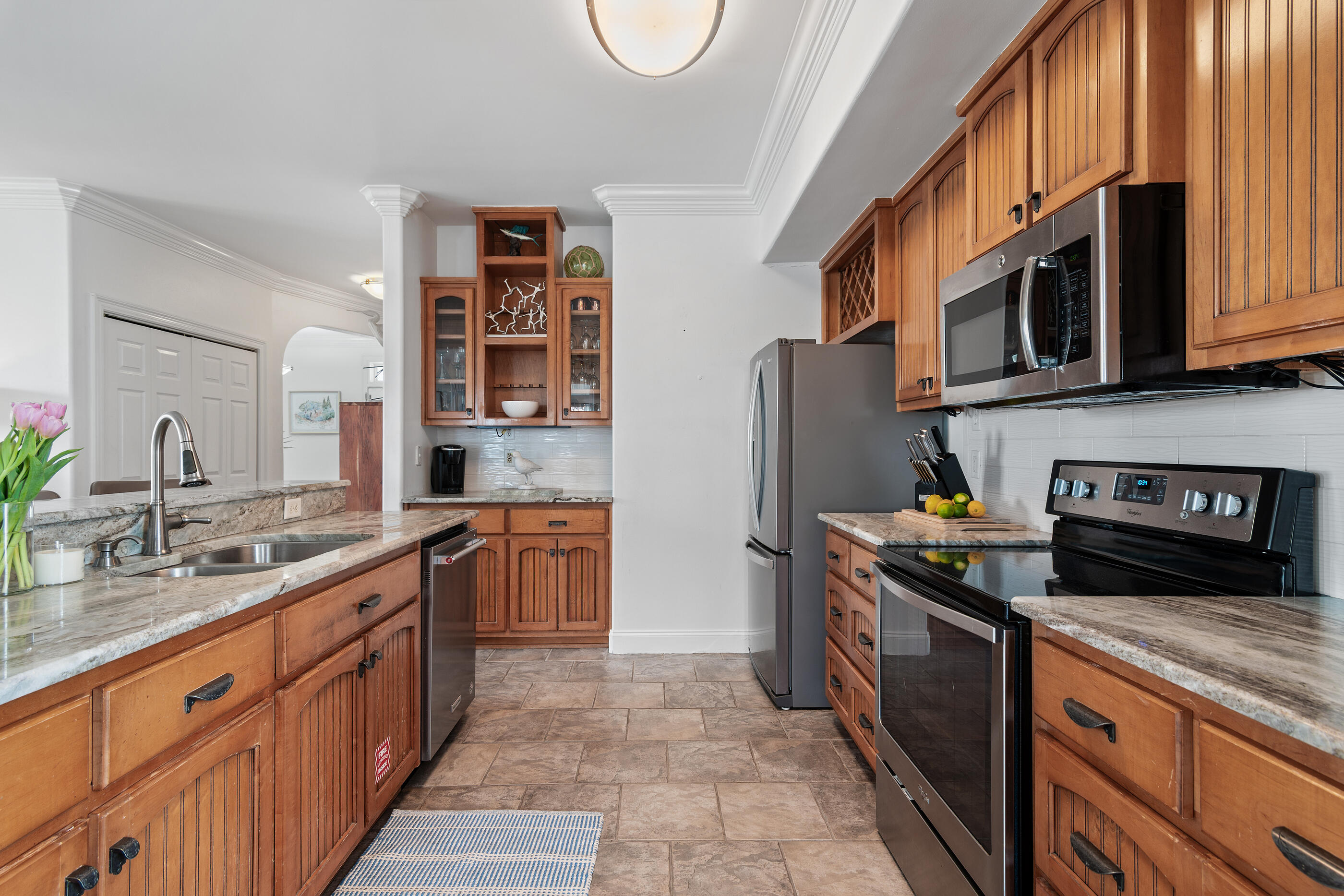 34 Beachside Drive Santa Rosa Beach, FL 32459 - Photo 21 of 65 a kitchen with stainless steel appliances granite countertop a stove a sink and a microwave