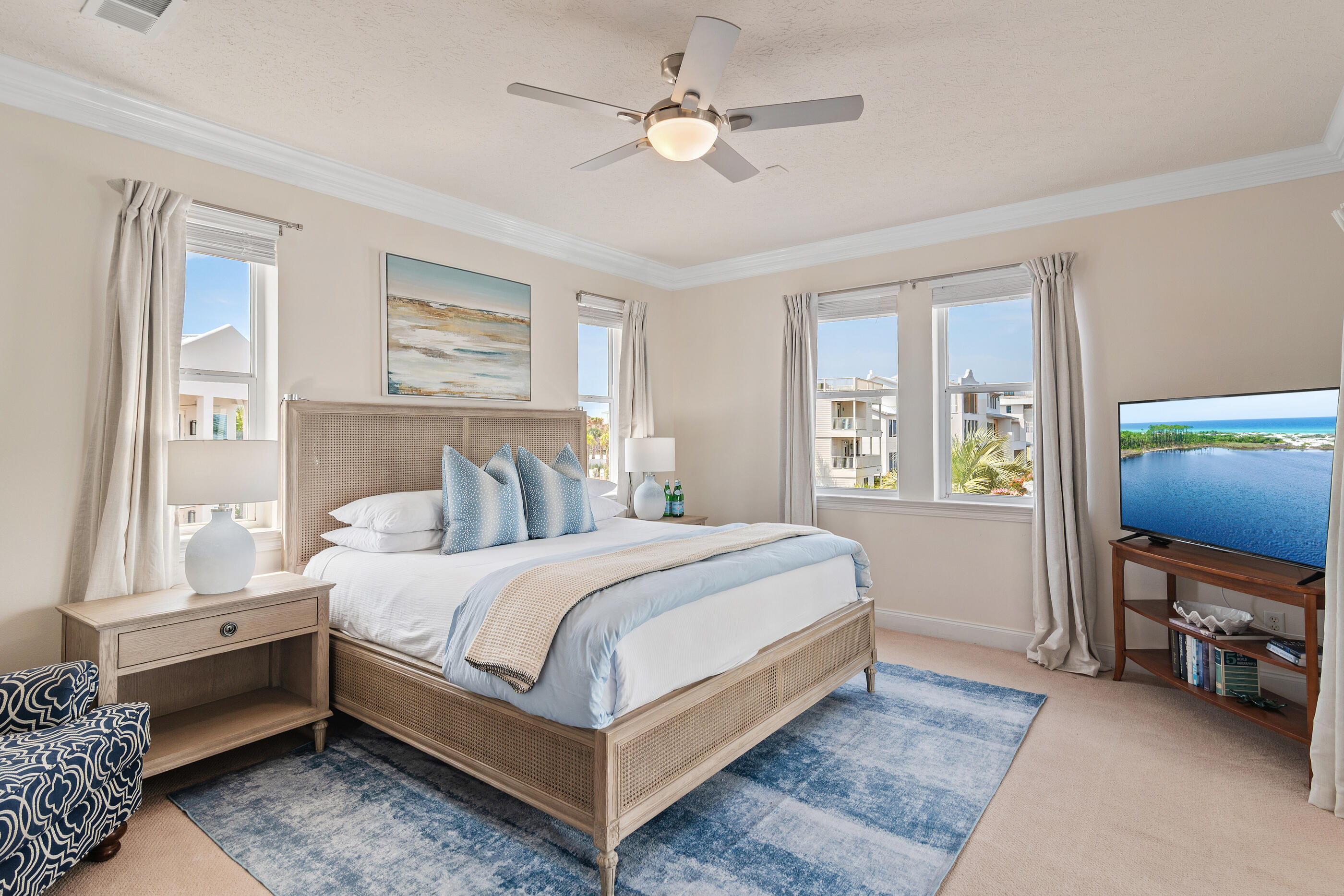 34 Beachside Drive Santa Rosa Beach, FL 32459 - Photo 22 of 65 a bedroom with a bed and a chandelier