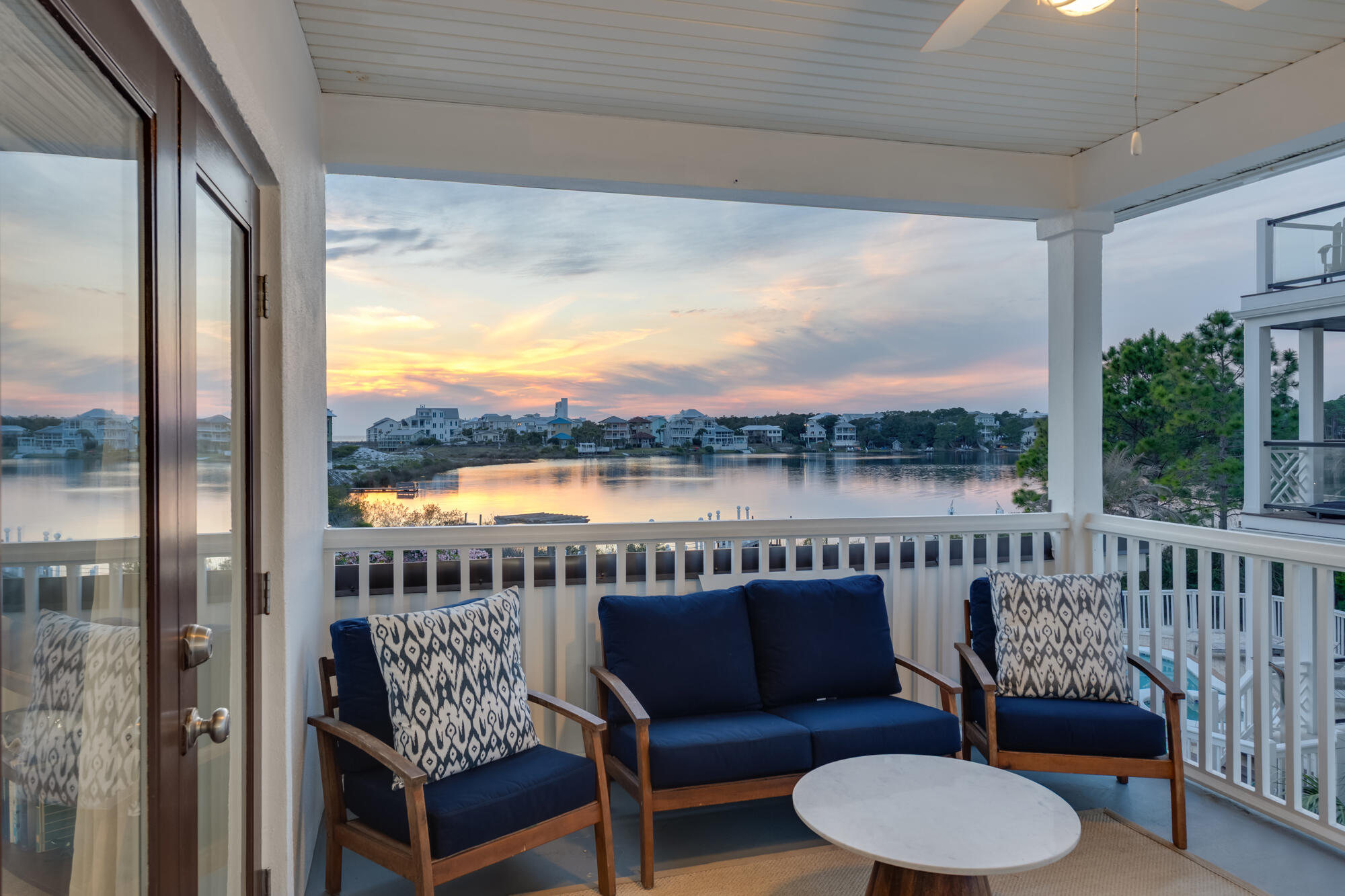 34 Beachside Drive Santa Rosa Beach, FL 32459 - Photo 25 of 65 a balcony with furniture and a floor to ceiling window