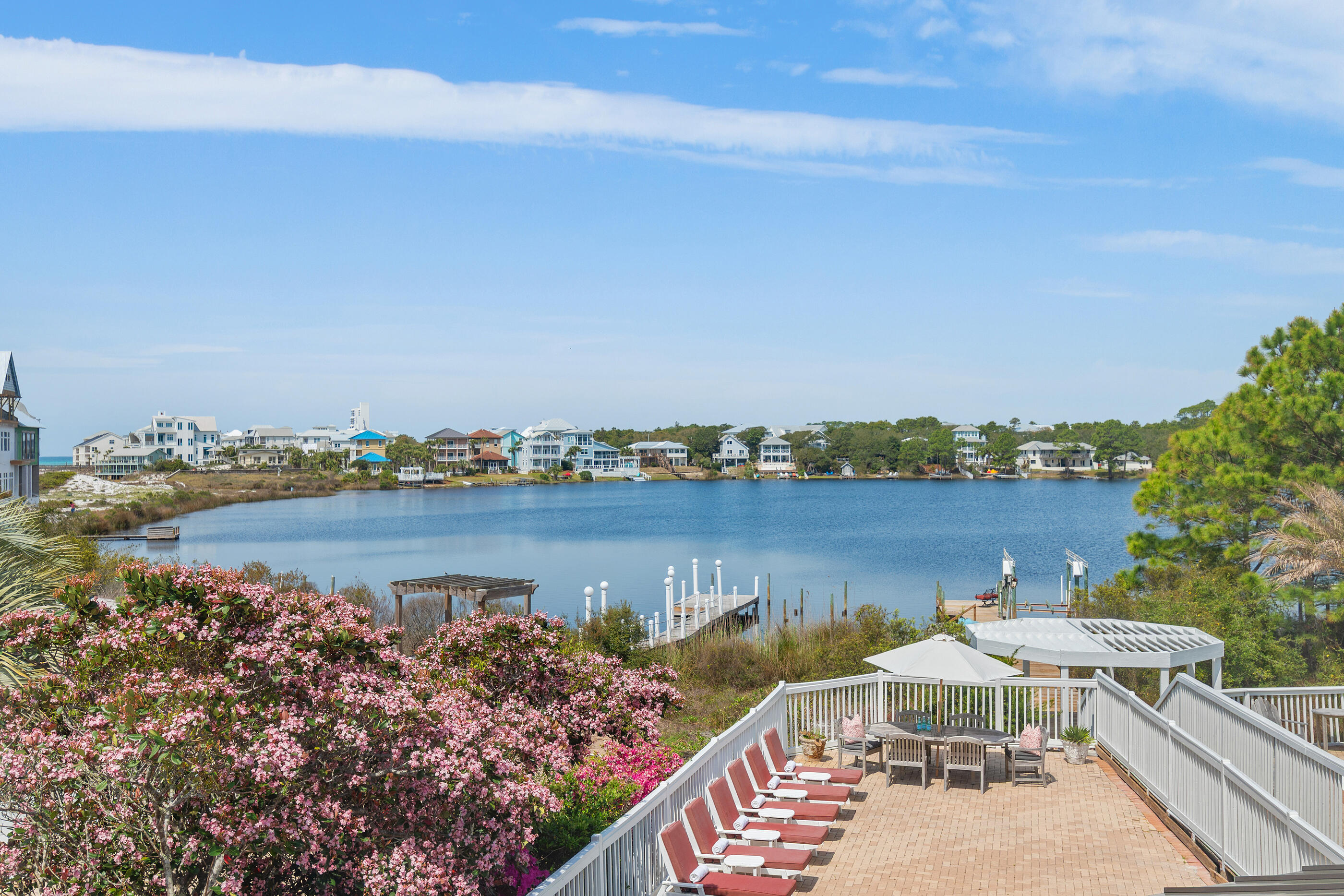 34 Beachside Drive Santa Rosa Beach, FL 32459 - Photo 26 of 65 a view of a lake with a table and chairs