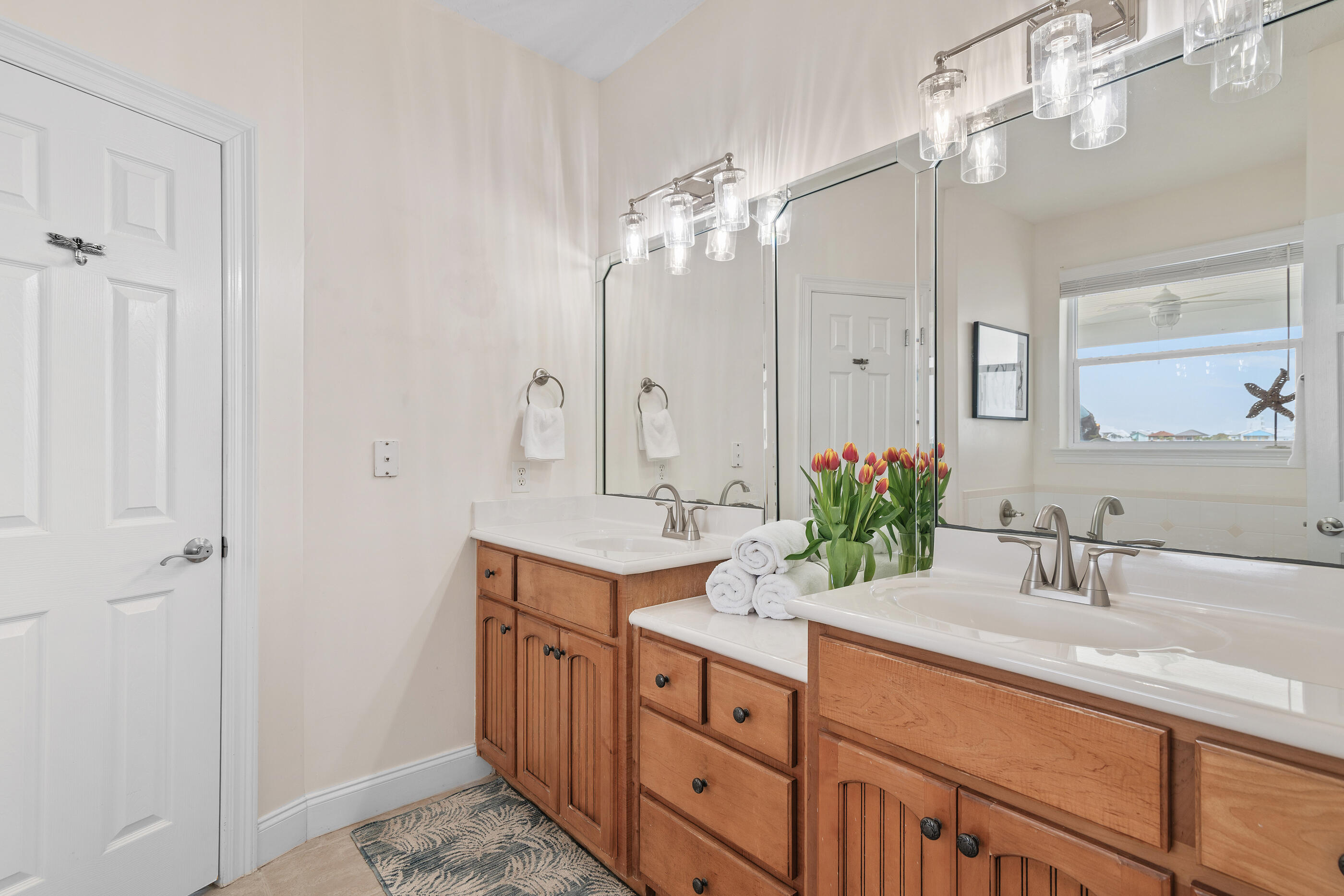 34 Beachside Drive Santa Rosa Beach, FL 32459 - Photo 27 of 65 a bathroom with a double vanity sink a mirror and a shower