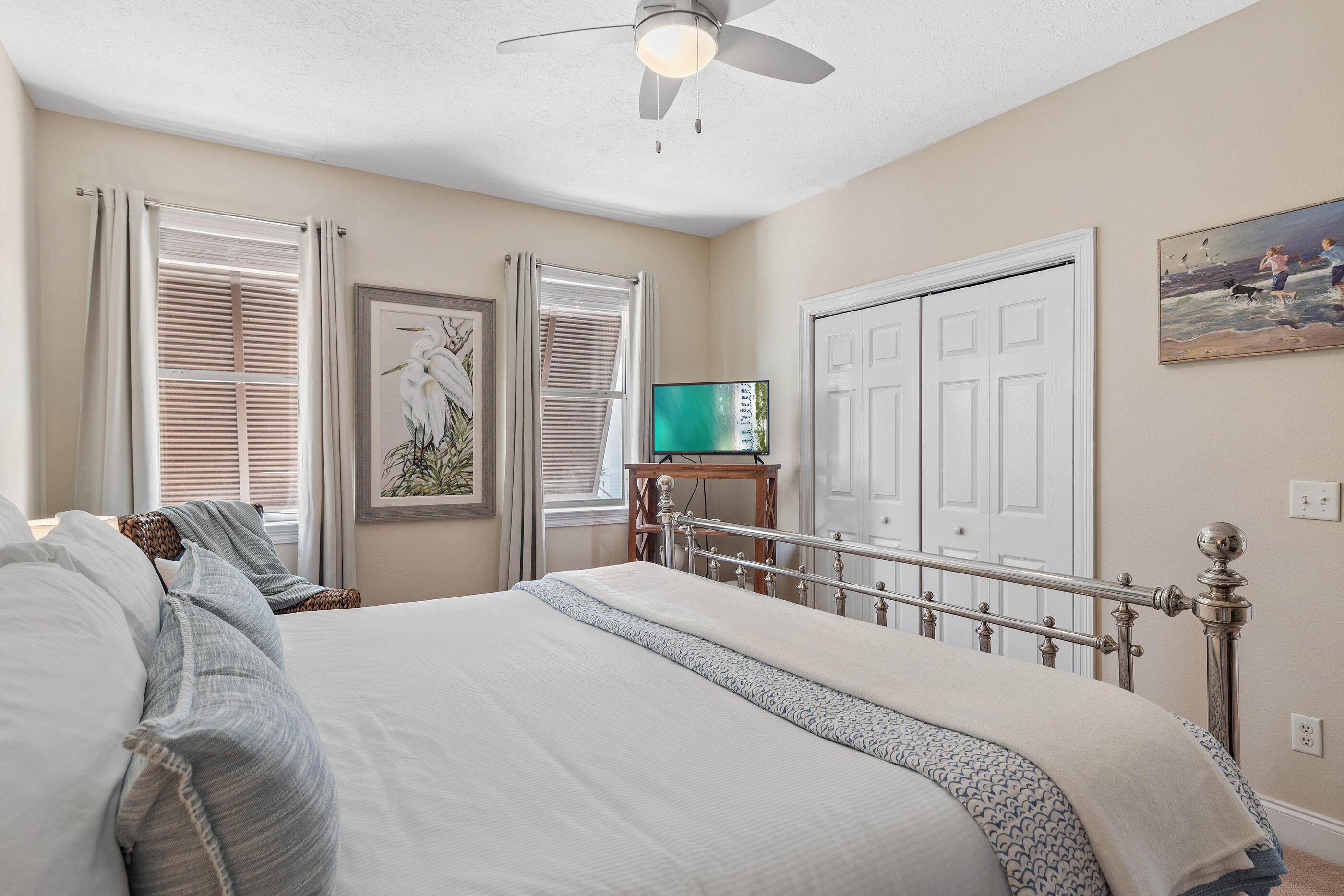 34 Beachside Drive Santa Rosa Beach, FL 32459 - Photo 33 of 65 a bedroom with a bed a large window and potted plant