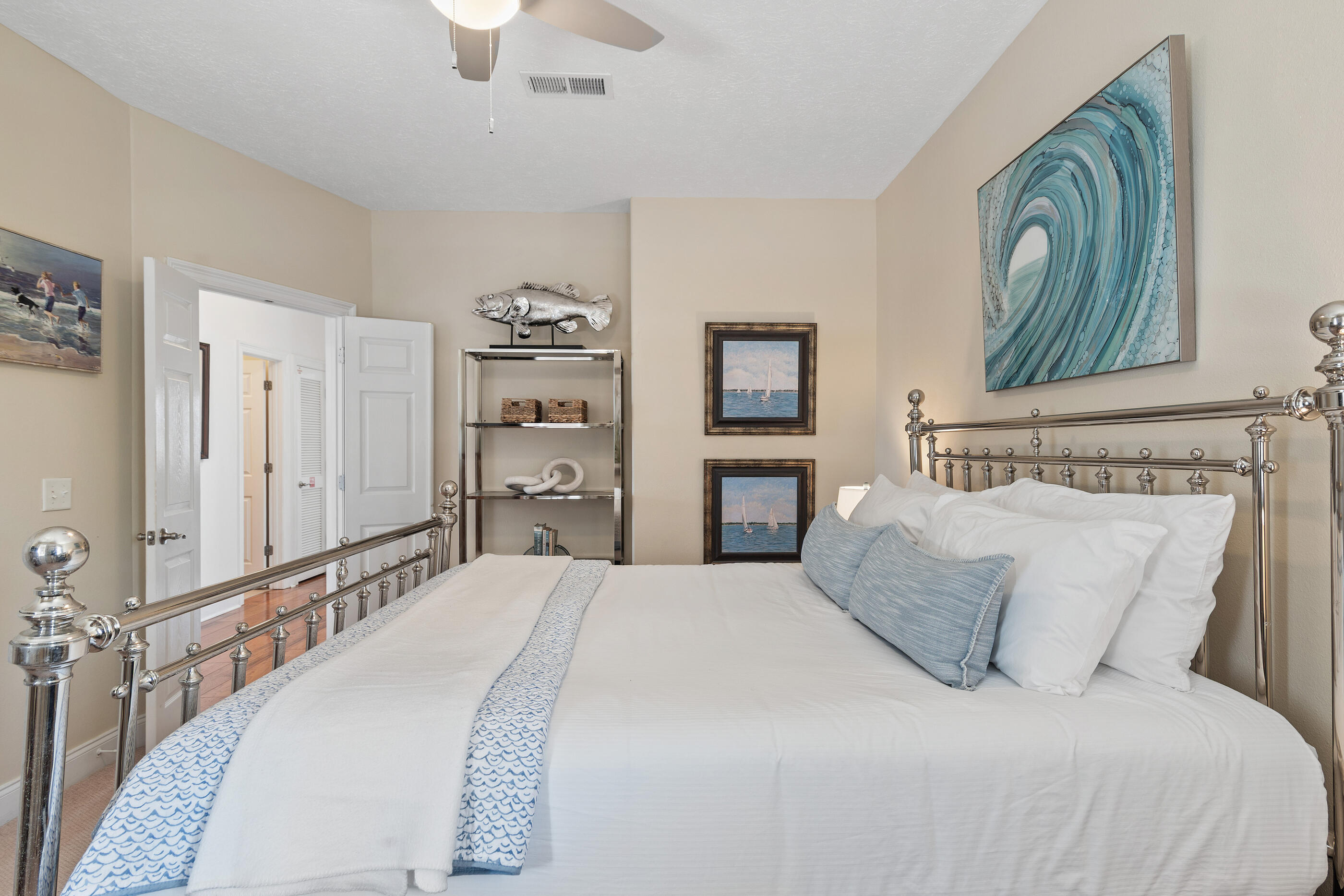 34 Beachside Drive Santa Rosa Beach, FL 32459 - Photo 34 of 65 a bedroom with a bed and a chandelier