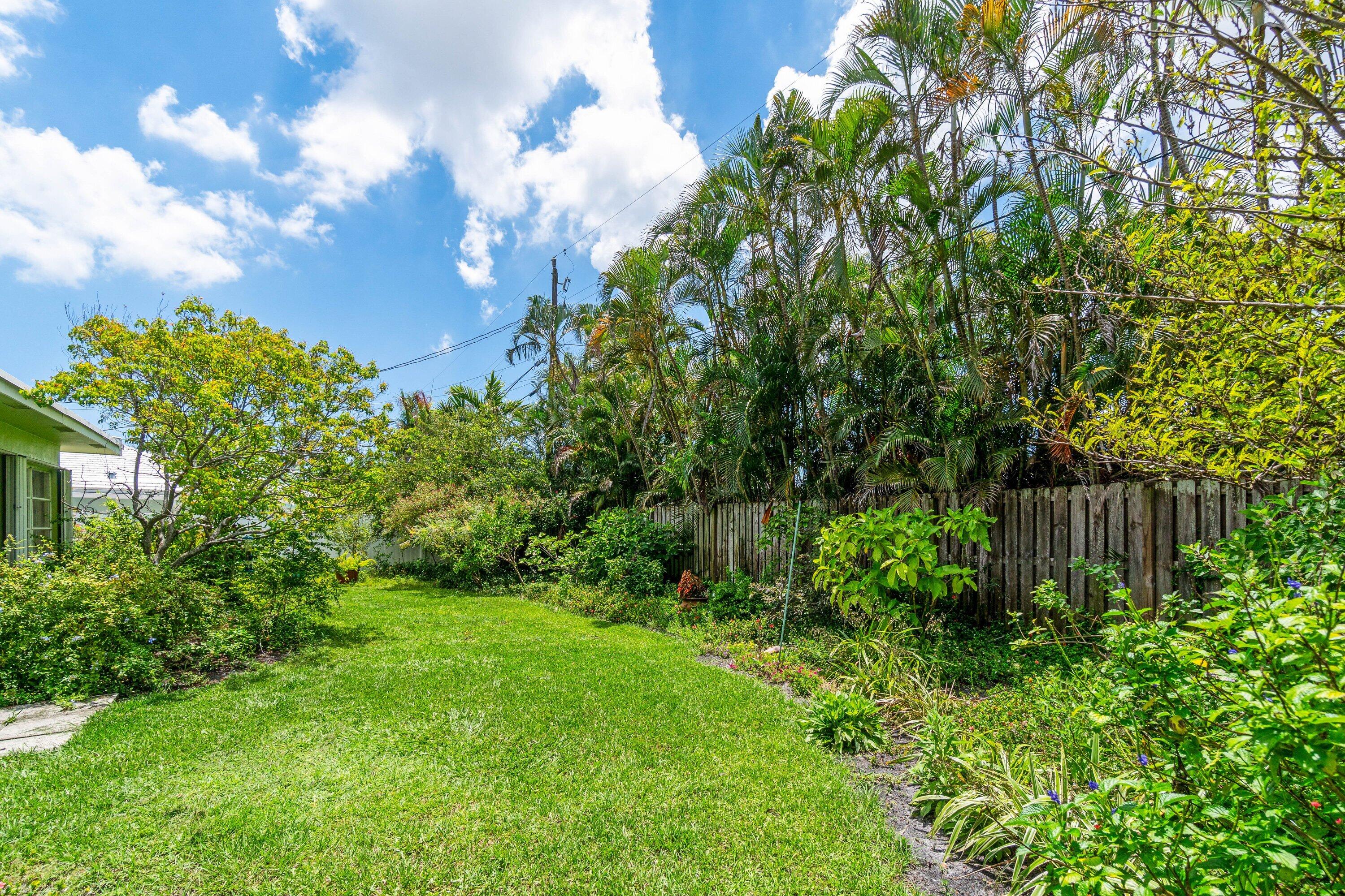 1290 Southwest 8th Street Boca Raton, FL 33486 - Photo 26 of 29 a view of garden with plants and trees