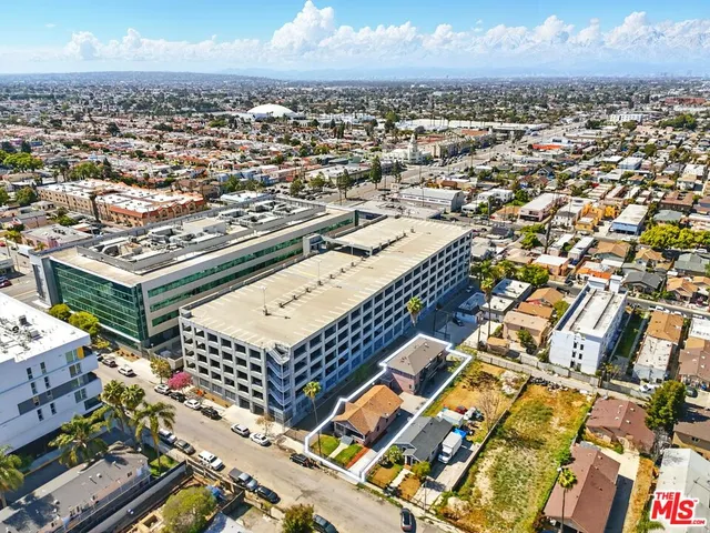 a view of a house with a wooden deck