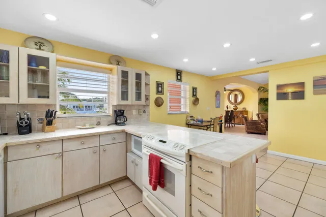 a kitchen with a sink and large window
